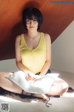 A woman laying on the floor in a room.