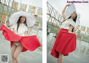 A woman in a white hat and red skirt posing for the camera.