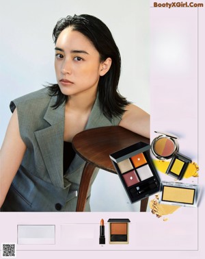 A magazine spread with a woman's face and makeup products.