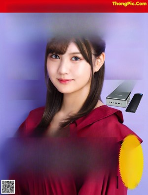 A woman in a red jacket is posing for a magazine.