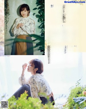 A woman sitting on a chair in front of flowers.