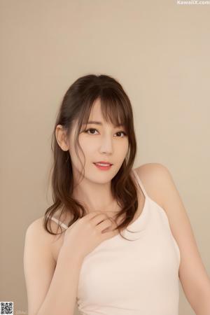 A naked asian woman in a black dress posing for the camera.