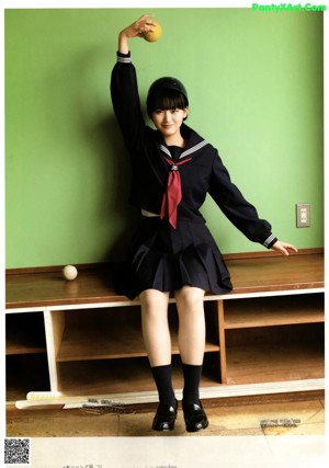 A young woman with long brown hair posing for a magazine.