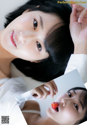A woman in a white bra with a cherry on her chest.