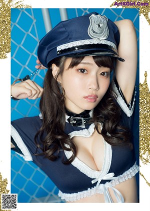 A woman in a police uniform is posing for a picture.