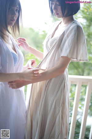 A couple of women that are standing next to each other.